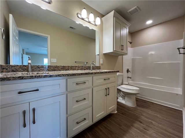 full bathroom featuring shower / bath combination, vanity, toilet, and wood-type flooring