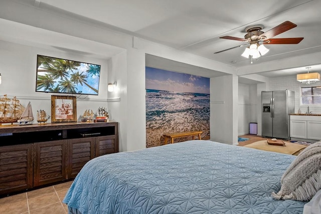 bedroom featuring ceiling fan, light tile patterned flooring, a sink, stainless steel refrigerator with ice dispenser, and a bar