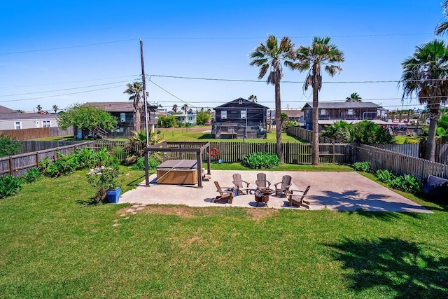 view of yard featuring an outdoor fire pit, a patio area, a residential view, and a fenced backyard