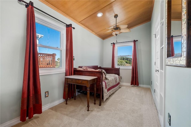 carpeted bedroom featuring ceiling fan, wood ceiling, and lofted ceiling