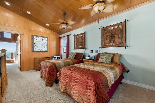 bedroom with ceiling fan, light colored carpet, wood ceiling, and multiple windows