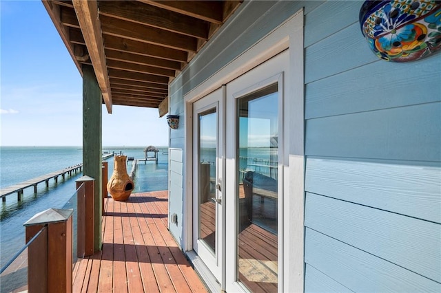 balcony featuring a water view