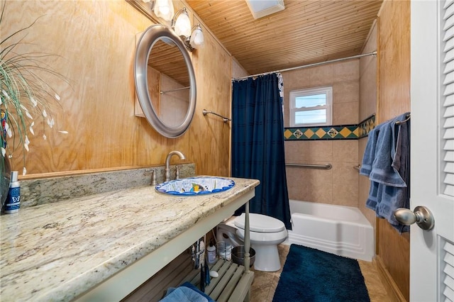 full bathroom featuring sink, shower / bathtub combination with curtain, wooden ceiling, toilet, and wood walls