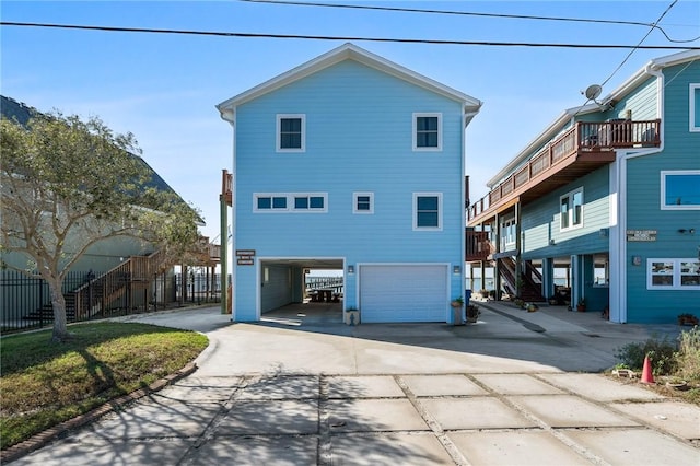 rear view of house featuring a garage