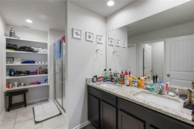 7606 Herd Rider, Corpus Christi, TX 78414 - full bathroom with a stall shower, tile patterned floors, double vanity, and a walk in closet