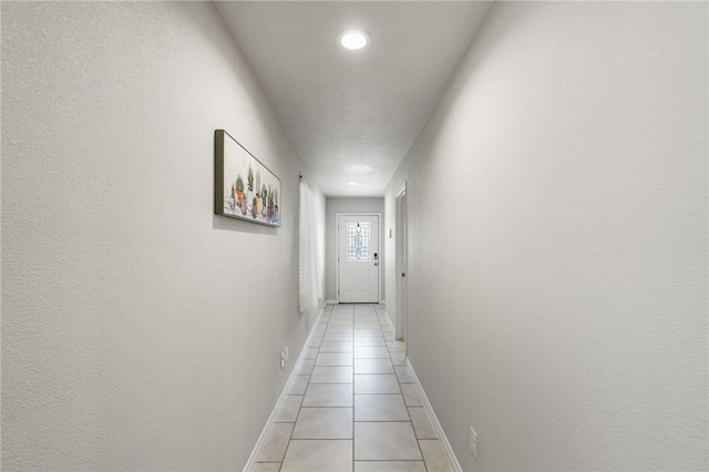 7606 Herd Rider, Corpus Christi, TX 78414 - corridor featuring light tile patterned floors, baseboards, and recessed lighting