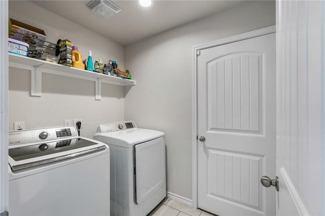 7606 Herd Rider, Corpus Christi, TX 78414 - washroom with washing machine and clothes dryer and light tile patterned floors
