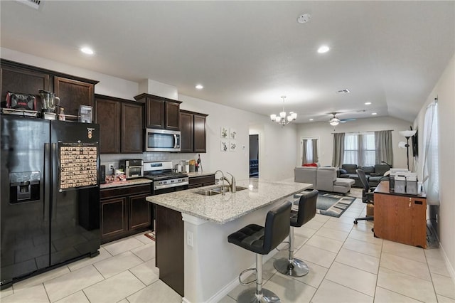 7606 Herd Rider, Corpus Christi, TX 78414 - kitchen featuring appliances with stainless steel finishes, a sink, light tile patterned floors, a chandelier, and recessed lighting
