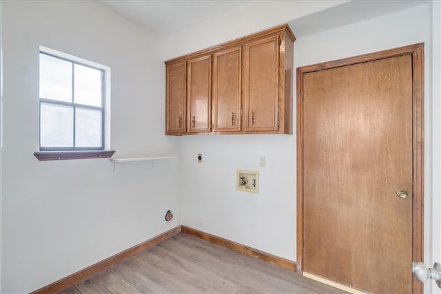 clothes washing area with light hardwood / wood-style flooring, electric dryer hookup, cabinets, and washer hookup