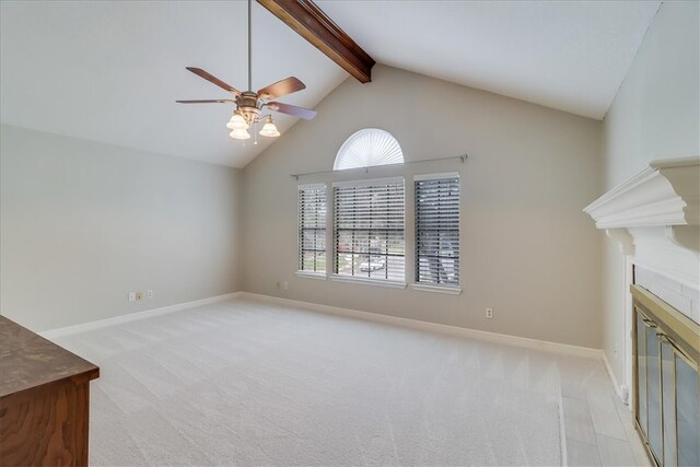 unfurnished living room featuring high vaulted ceiling, light carpet, beamed ceiling, and ceiling fan