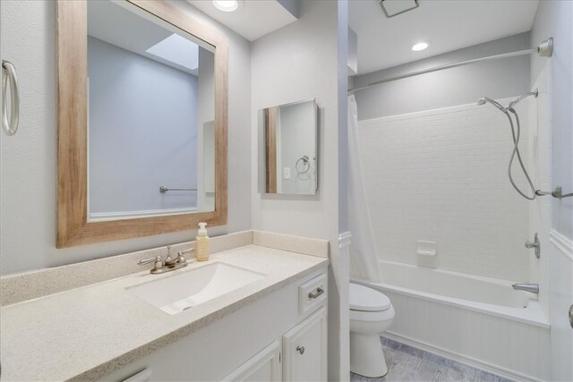 full bathroom with vanity, tub / shower combination, and toilet