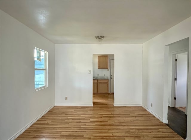 spare room featuring light hardwood / wood-style floors