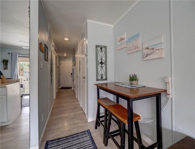 3938 Surfside Blvd Unit 3124, Corpus Christi, TX 78402 - hallway featuring ornamental molding, light wood-type flooring, baseboards, and recessed lighting