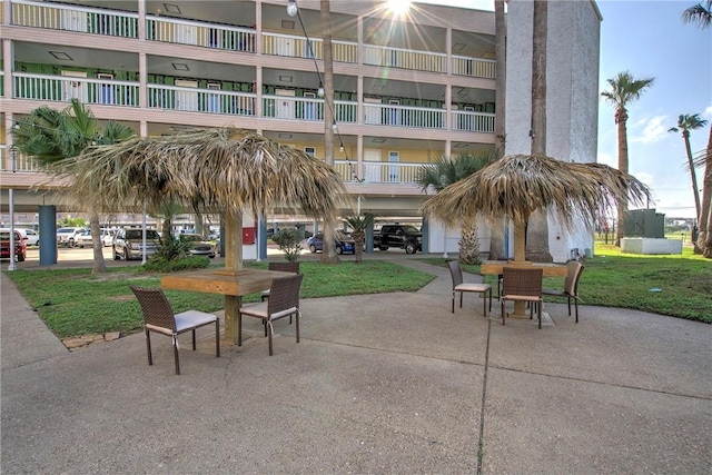 3938 Surfside Blvd Unit 3124, Corpus Christi, TX 78402 - view of community with outdoor dining space, a patio, and a yard