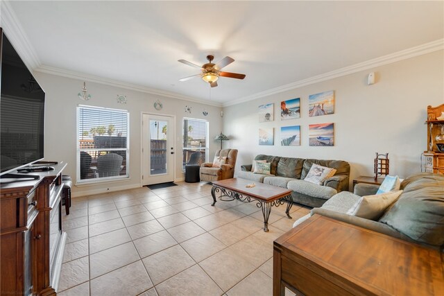 tiled living room featuring ceiling fan and crown molding