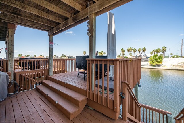 wooden deck with a water view