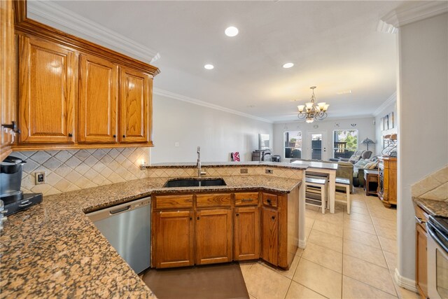 kitchen with dishwasher, a chandelier, sink, and crown molding