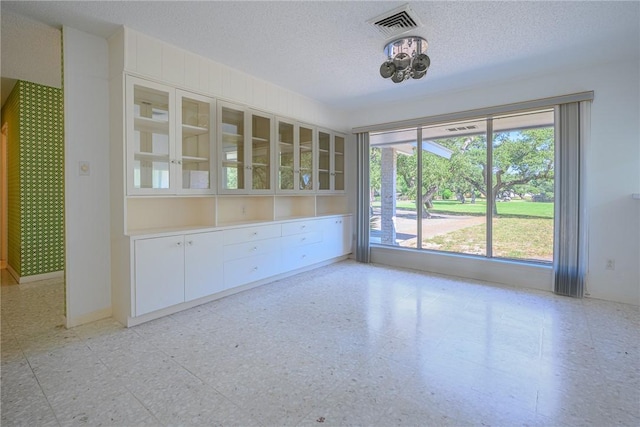 1405 Omohundro St, Rockport, TX 78382 - empty room with a textured ceiling, light floors, and baseboards