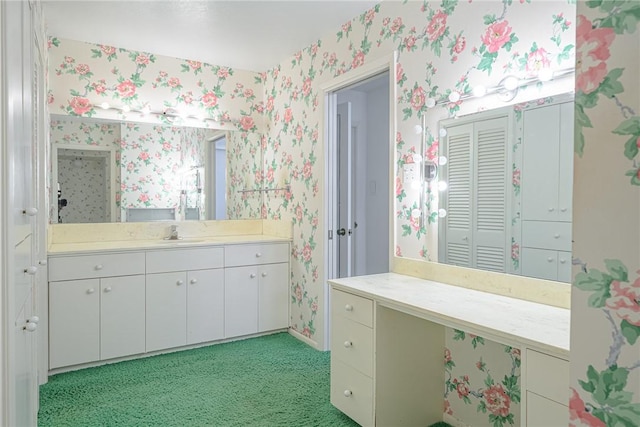 1405 Omohundro St, Rockport, TX 78382 - bathroom featuring wallpapered walls, vanity, and baseboards