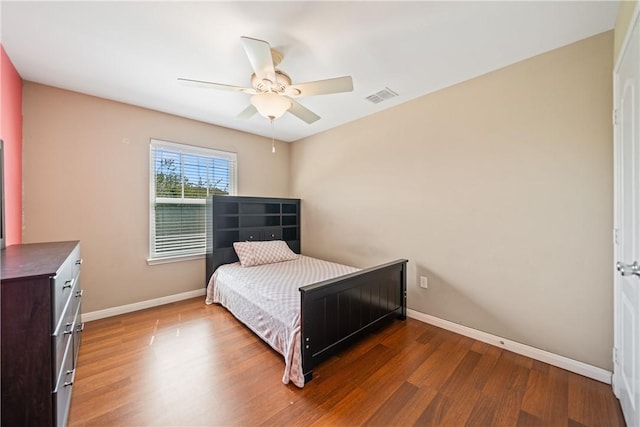 6126 Saint Denis St, Corpus Christi, TX 78414 - bedroom featuring wood finished floors, baseboards, and ceiling fan