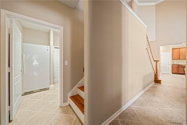 6126 Saint Denis St, Corpus Christi, TX 78414 - hallway with stairway, light tile patterned floors, baseboards, and ornamental molding