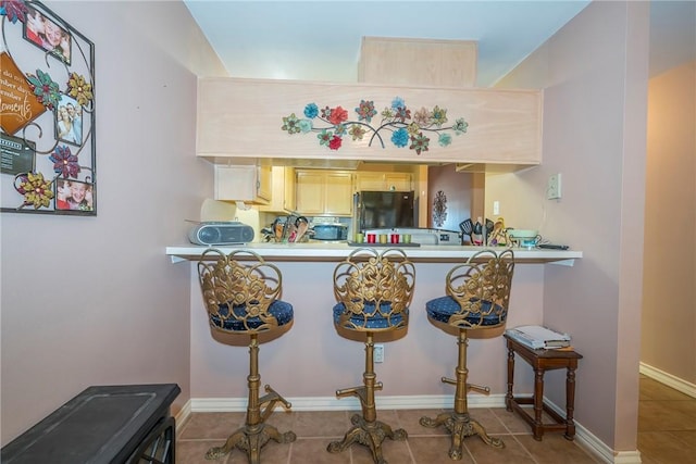 13656 Teague Ln Unit 22, Corpus Christi, TX 78410 - bar area with freestanding refrigerator and tile patterned floors