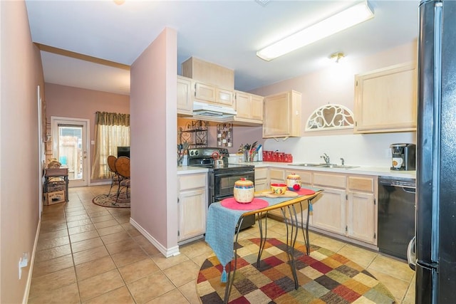 13656 Teague Ln Unit 22, Corpus Christi, TX 78410 - kitchen featuring black appliances, light tile patterned floors, under cabinet range hood, and light countertops