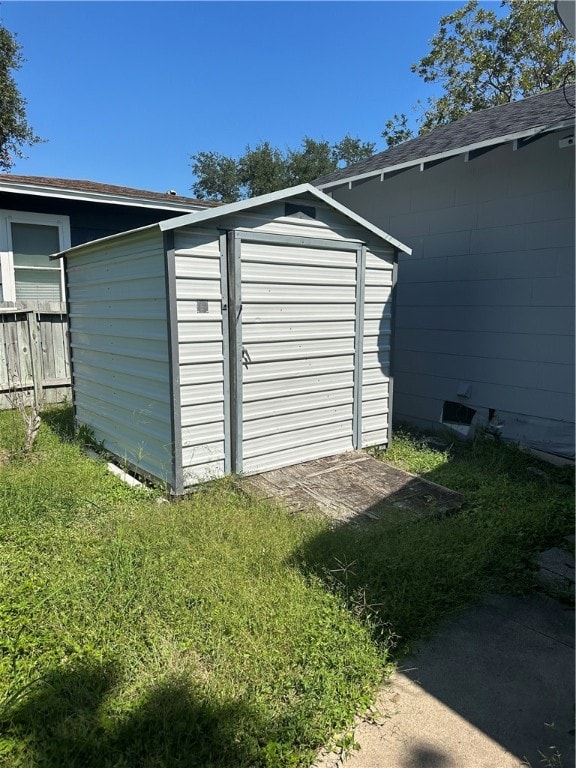 garage featuring a yard