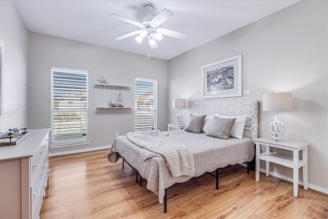 bedroom featuring ceiling fan and light hardwood / wood-style flooring