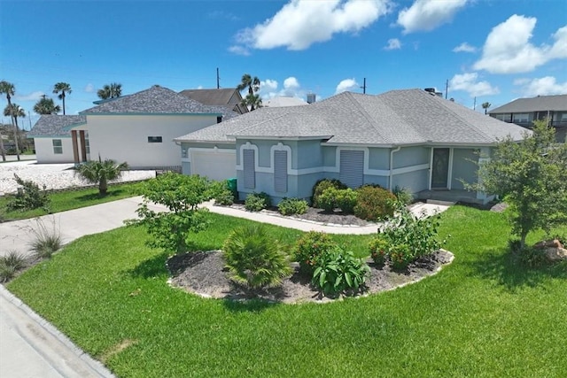 123 Sea Mist Dr, Aransas Pass, TX 78336 - view of front of home featuring an attached garage, stucco siding, a front yard, and concrete driveway