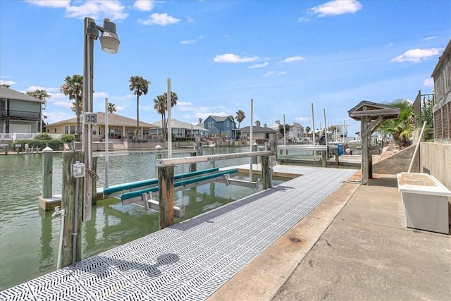 123 Sea Mist Dr, Aransas Pass, TX 78336 - dock featuring boat lift, a water view, and a residential view