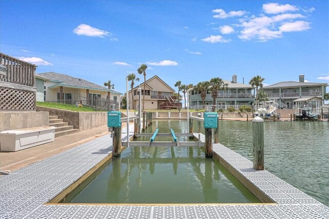 123 Sea Mist Dr, Aransas Pass, TX 78336 - dock with a residential view, a water view, and boat lift