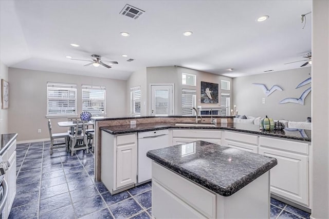 123 Sea Mist Dr, Aransas Pass, TX 78336 - kitchen featuring ceiling fan, white dishwasher, a sink, a kitchen island, and recessed lighting