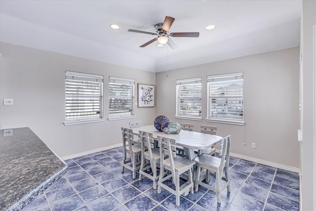 dining space with ceiling fan