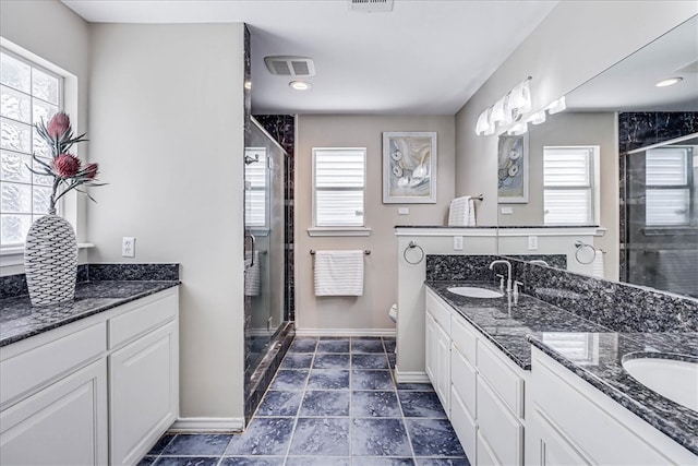 bathroom with toilet, walk in shower, and a wealth of natural light