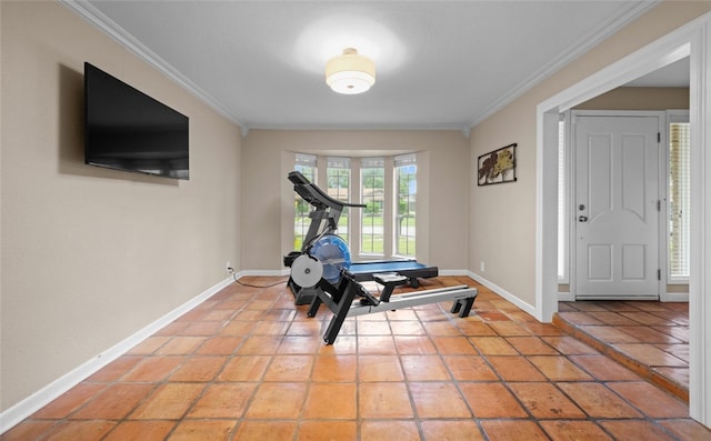 workout room with tile patterned flooring and crown molding