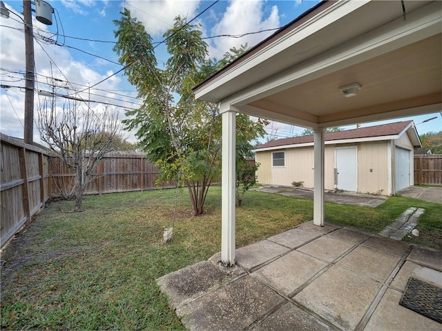4821 Kosarek Dr, Corpus Christi, TX 78415 - fenced backyard featuring a patio area and an outdoor structure