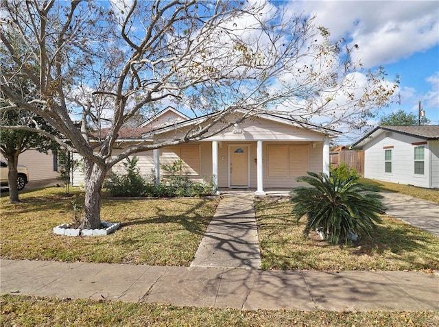 bungalow featuring a porch and a front yard