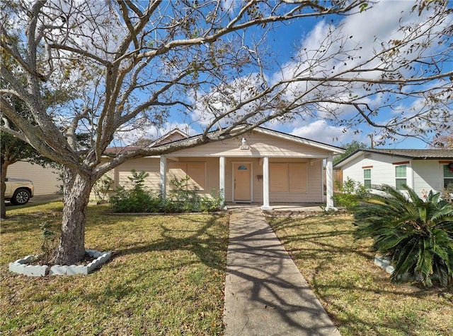 4821 Kosarek Dr, Corpus Christi, TX 78415 - view of front of property featuring covered porch and a front yard