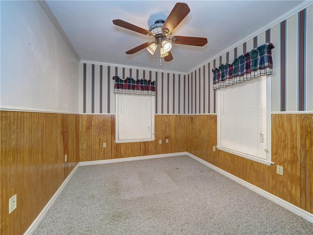 4821 Kosarek Dr, Corpus Christi, TX 78415 - spare room featuring crown molding, wainscoting, ceiling fan, and carpet