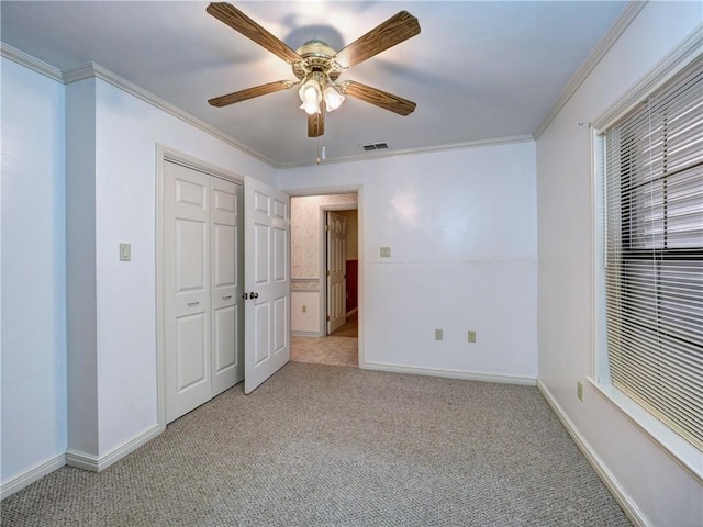 4821 Kosarek Dr, Corpus Christi, TX 78415 - unfurnished bedroom with light colored carpet, ornamental molding, ceiling fan, and a closet