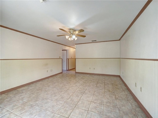 4821 Kosarek Dr, Corpus Christi, TX 78415 - unfurnished room with crown molding, a ceiling fan, and light tile patterned floors