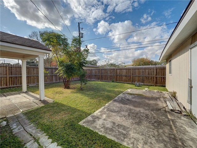 4821 Kosarek Dr, Corpus Christi, TX 78415 - fenced backyard with a patio area