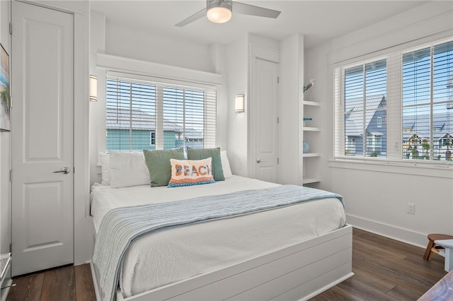 bedroom featuring ceiling fan and dark hardwood / wood-style floors