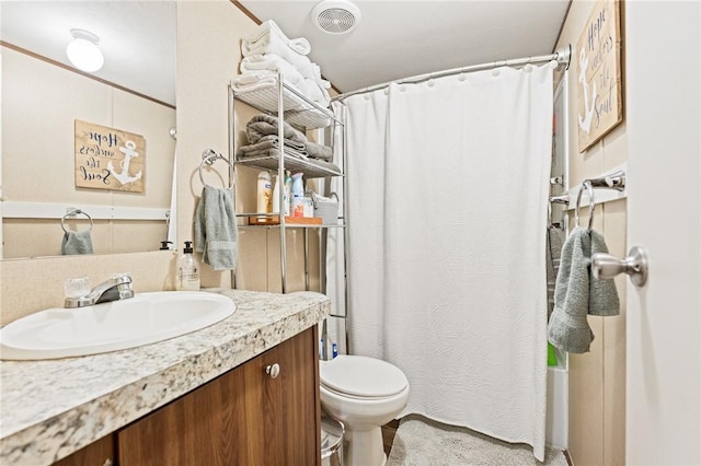 full bathroom featuring shower / tub combo, vanity, and toilet