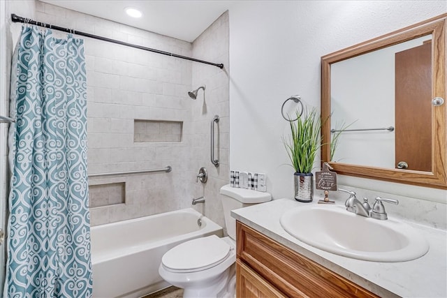 full bathroom featuring vanity, toilet, and tiled shower / bath combo