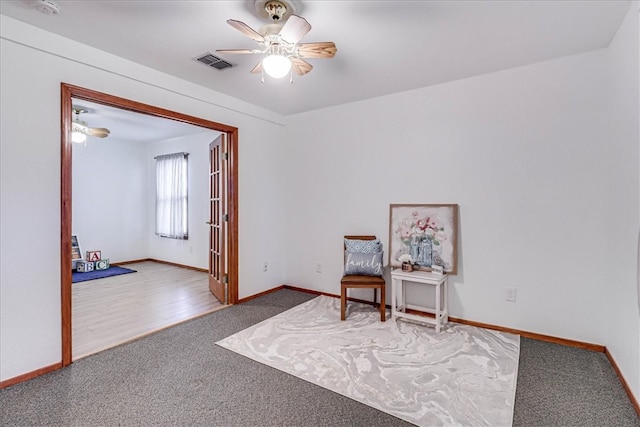 unfurnished room featuring hardwood / wood-style floors and ceiling fan