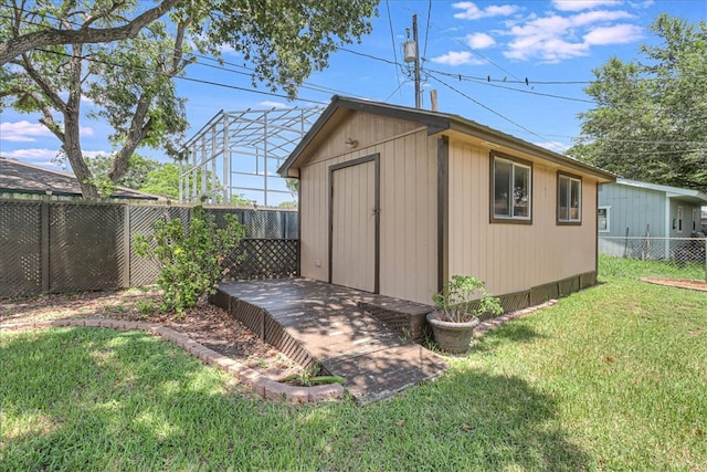 view of outbuilding with a lawn