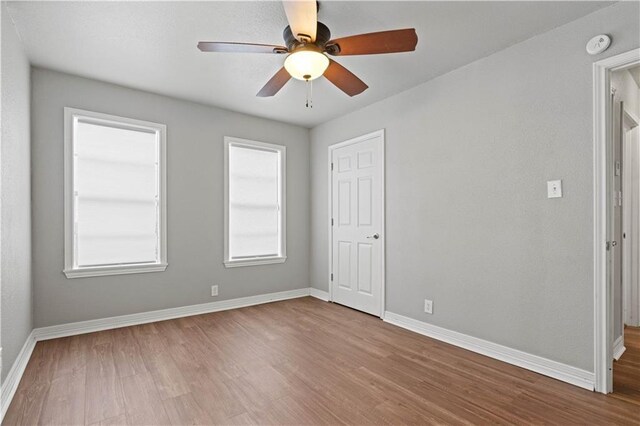 4446 Naples St, Corpus Christi, TX 78415 - unfurnished bedroom with wood finished floors and ceiling fan