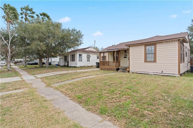 4446 Naples St, Corpus Christi, TX 78415 - view of front facade with a porch and a front lawn